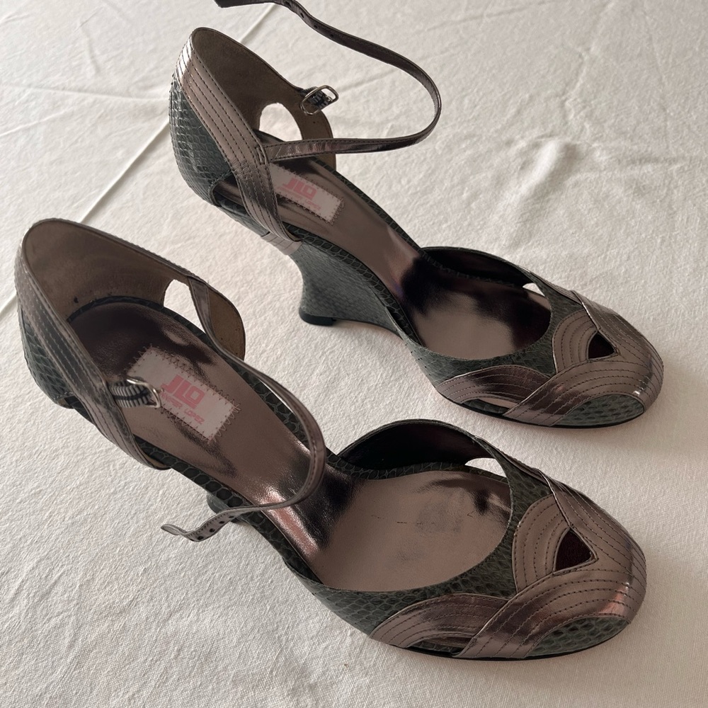 Silver metallic and grey snakeskin embossed leather heels. Never worn. Size 8.